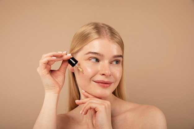 close-up-woman-with-beauty-product_23-2149182129